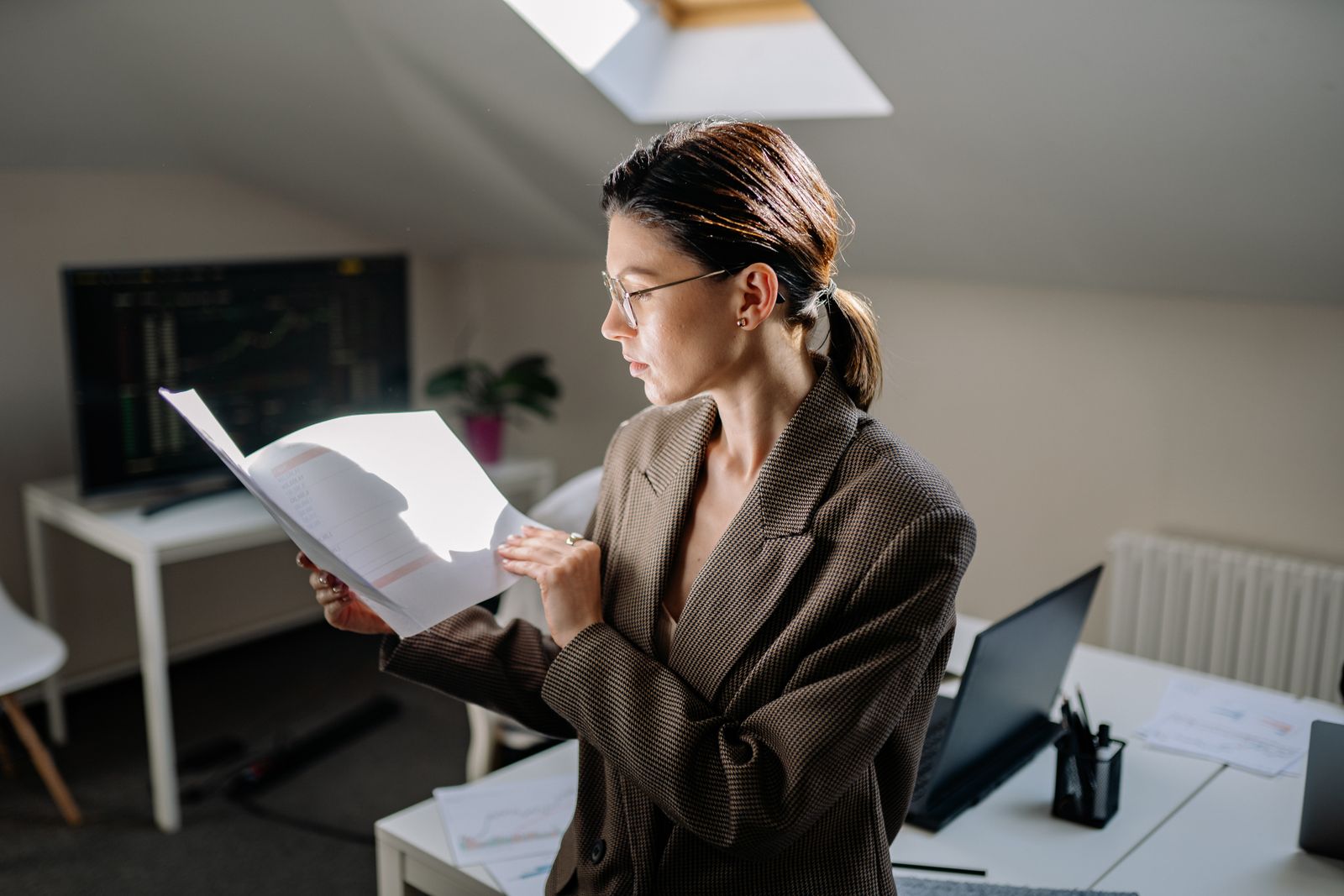 A healthcare-trained medical secretary reviewing a practice inbox
