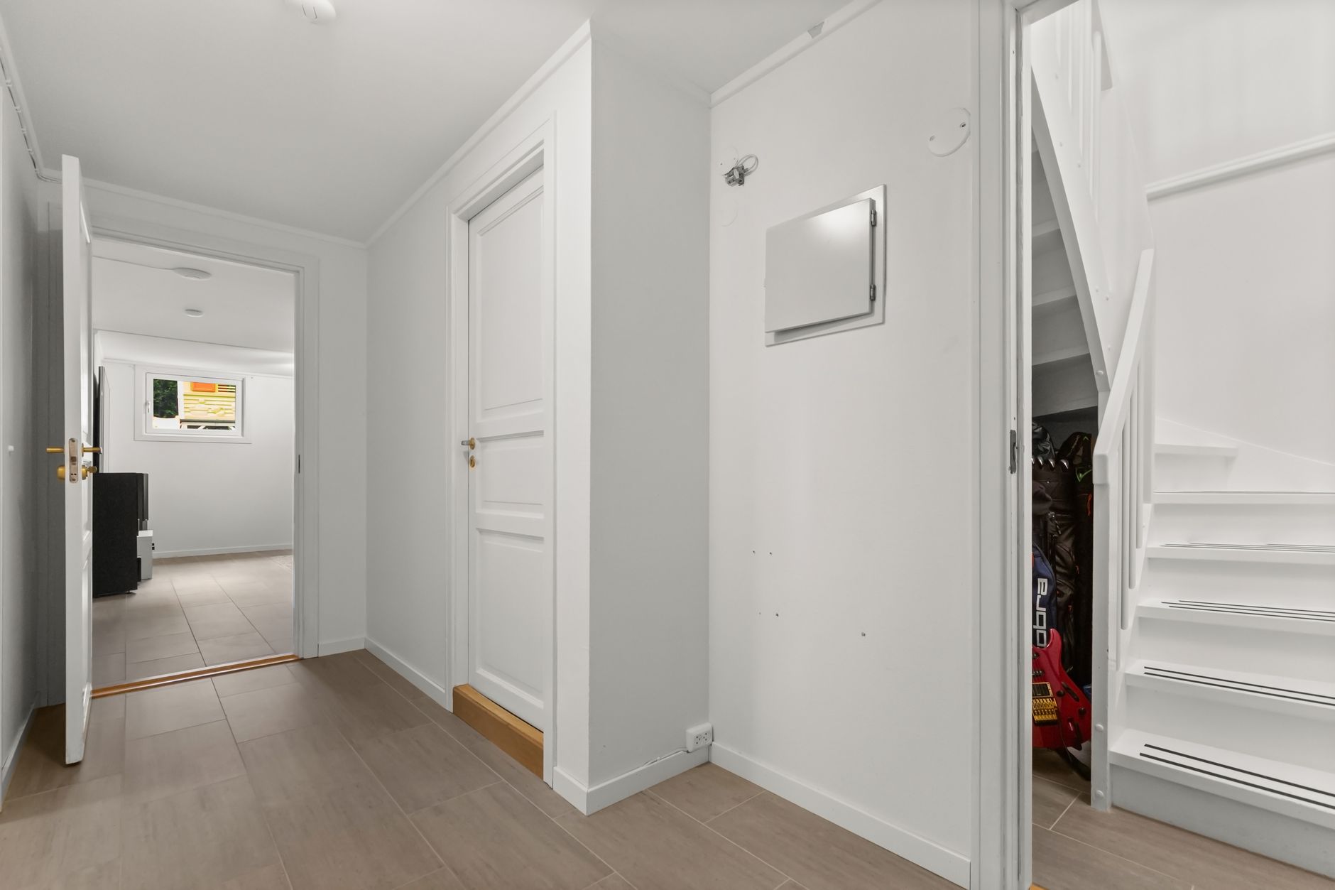 Bright white interior doorways in a calm, minimal space