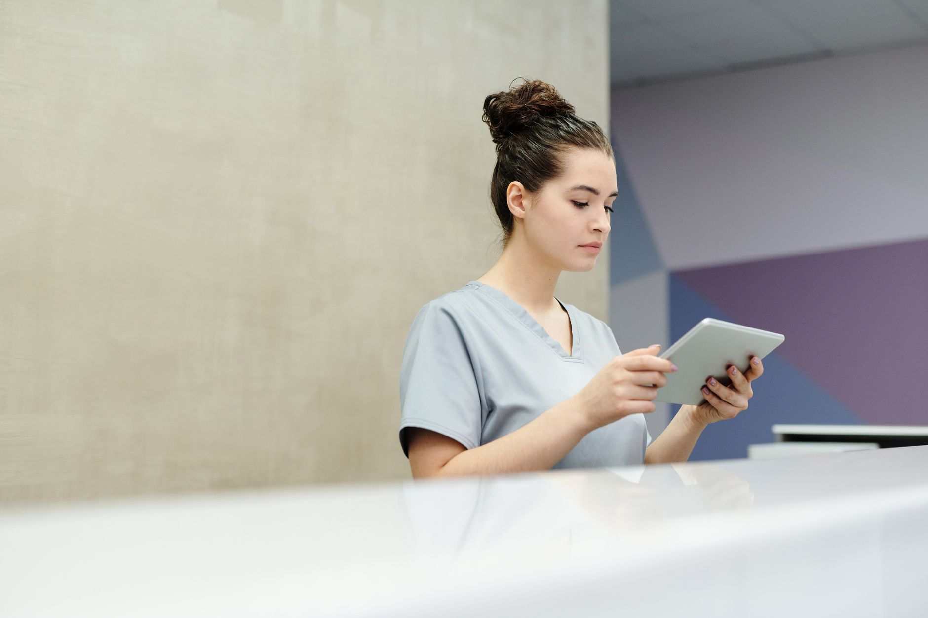 A medical secretary at work in a calm clinical office